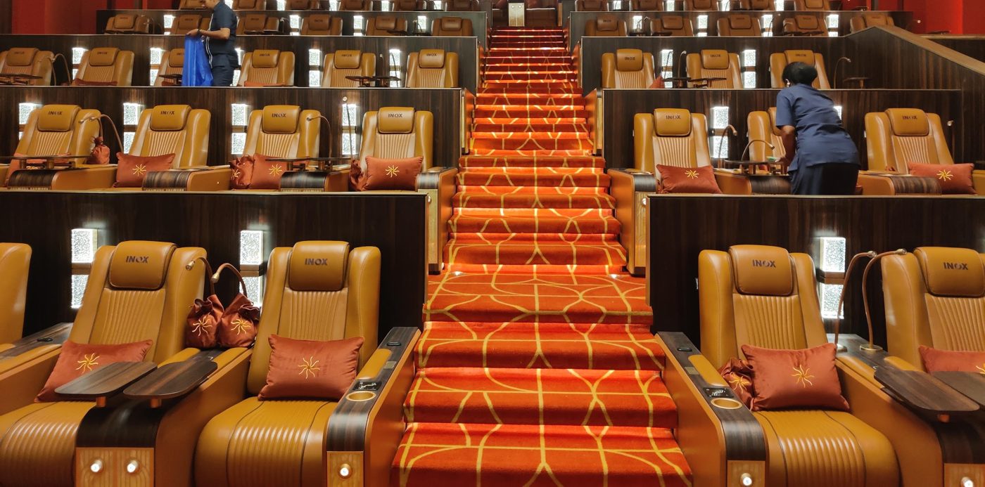 Multi-row luxury cinema recliners with motorized control panels